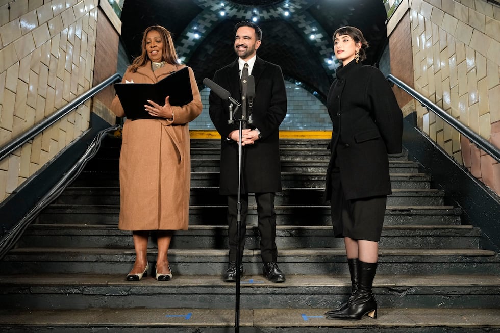New York Attorney General Letitia James left, prepares to administer the oath of office to...