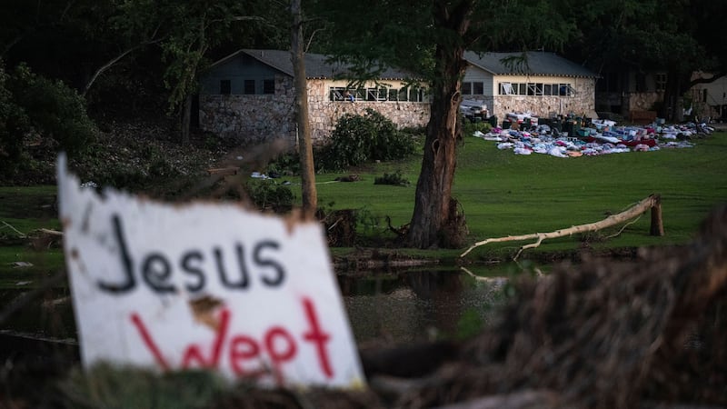 FILE - Campers belongings sit outside one of Camp Mystic's cabins near the Guadalupe River,...