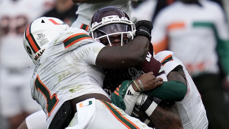 Texas A&M quarterback Marcel Reed (10) is tackled after a short run by Miami linebacker...