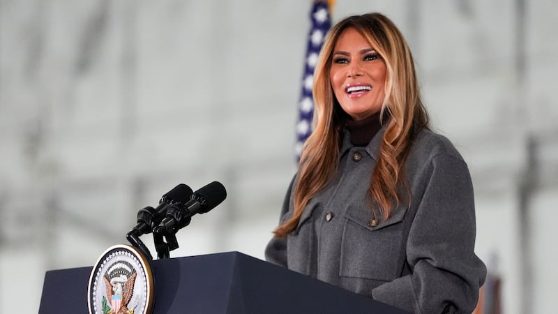 First lady Melania Trump speaks before building Red Cross holiday care packages and writing...