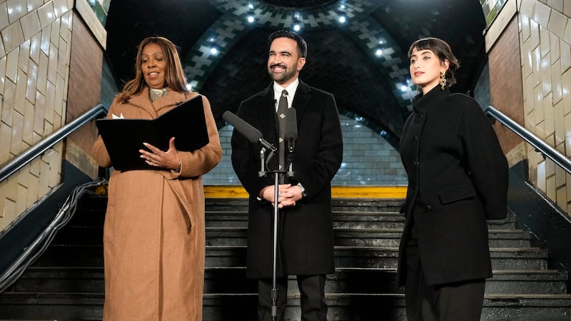 New York Attorney General Letitia James left, prepares to administer the oath of office to...