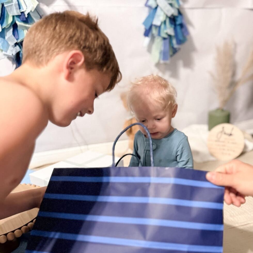 Baby Jack celebrating his birthday with his older brother.