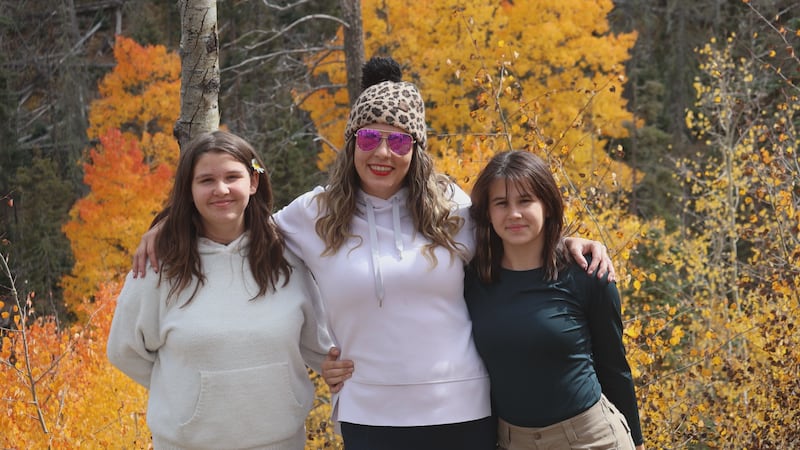 Tabetha Koerth and daughters pose for picture in vacation in the mountains of New Mexico.