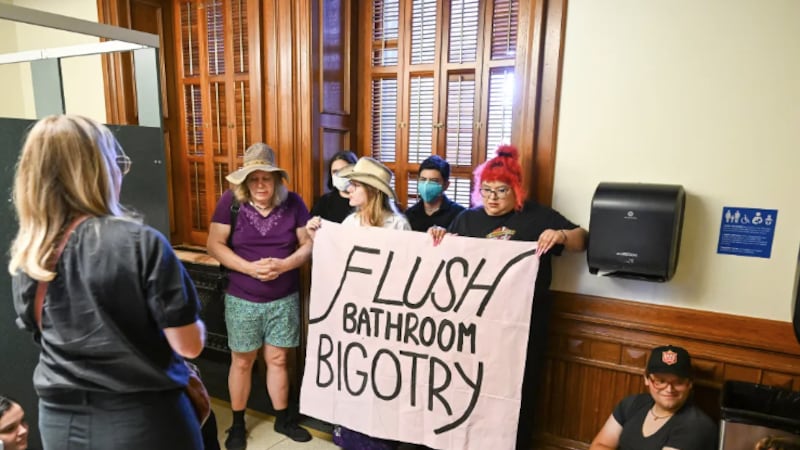 Activists from Trans Texas occupy the women's restroom on the first floor of the Texas Capitol...
