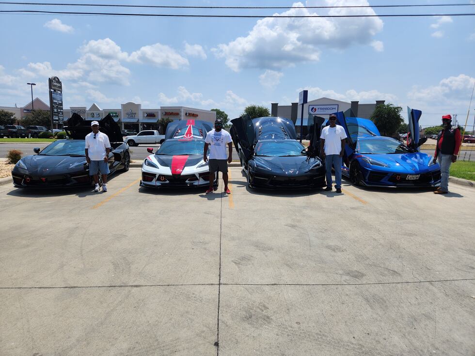 Members of the Mid Texas Corvette Club post by their vehicles at the Inspired Designs Hair...