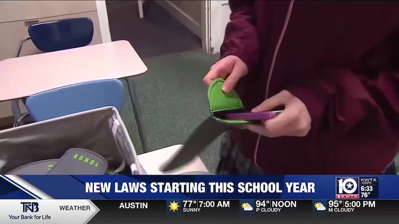 Student placing phone in Yondr Pouch