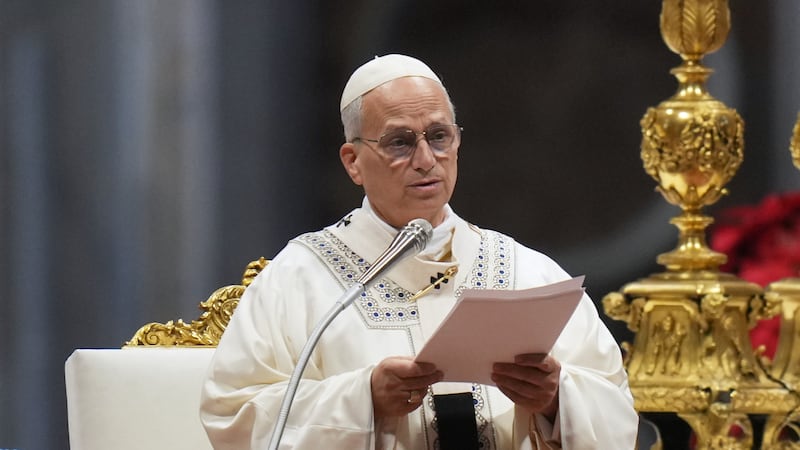 Pope Leo XIV reads the homily as he celebrates Mass on New Year's Day, in St. Peter's Basilica...