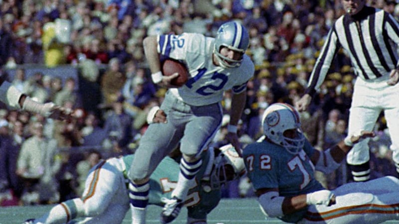 FILE - In this Jan. 16, 1972, file photo, Dallas Cowboys quarterback Roger Staubach (12) tries...