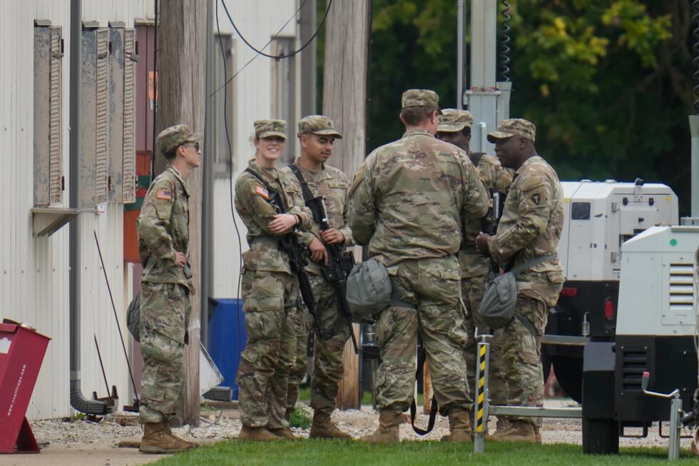Military personnel in uniform, with the Texas National Guard patch on, are seen at the U.S....