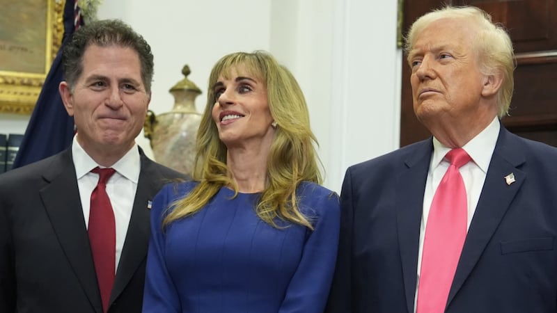 Michael Dell, left, his wife Susan and President Donald Trump listen during an event on "Trump...